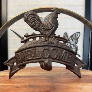 Iron rooster welcome sign